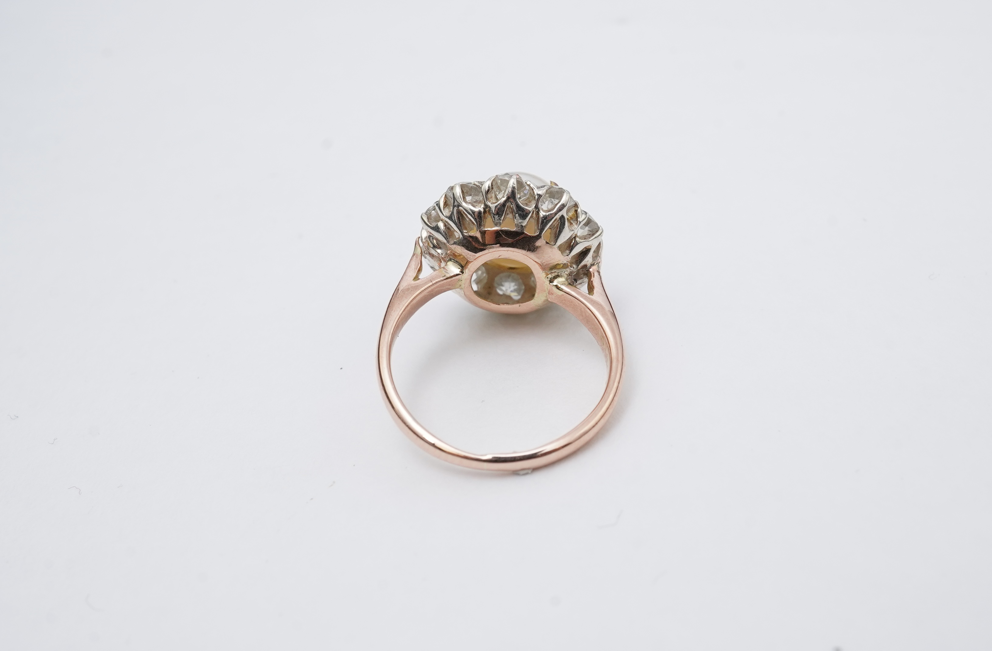 A cultured pearl and diamond ring